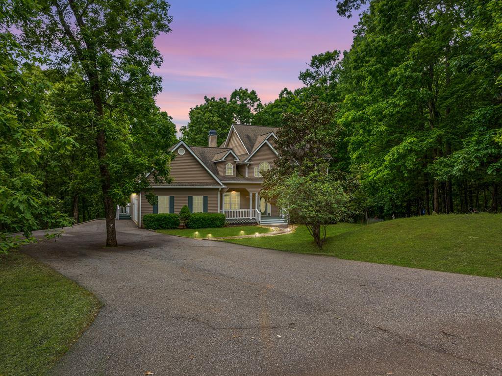 399 Hideaway Hills Road Blairsville, GA 30512 - Photo 2 of 77 a view of house with a big yard and large tree