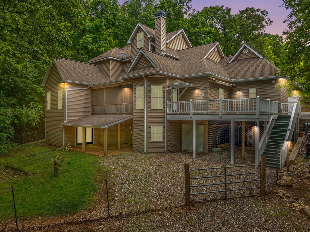399 Hideaway Hills Road Blairsville, GA 30512 - Photo 3 of 77 a front view of a house with a yard