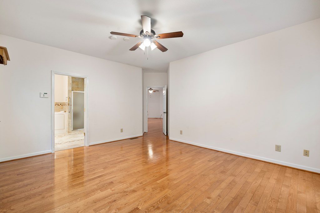 399 Hideaway Hills Road Blairsville, GA 30512 - Photo 39 of 77 a view of an empty room with wooden floor