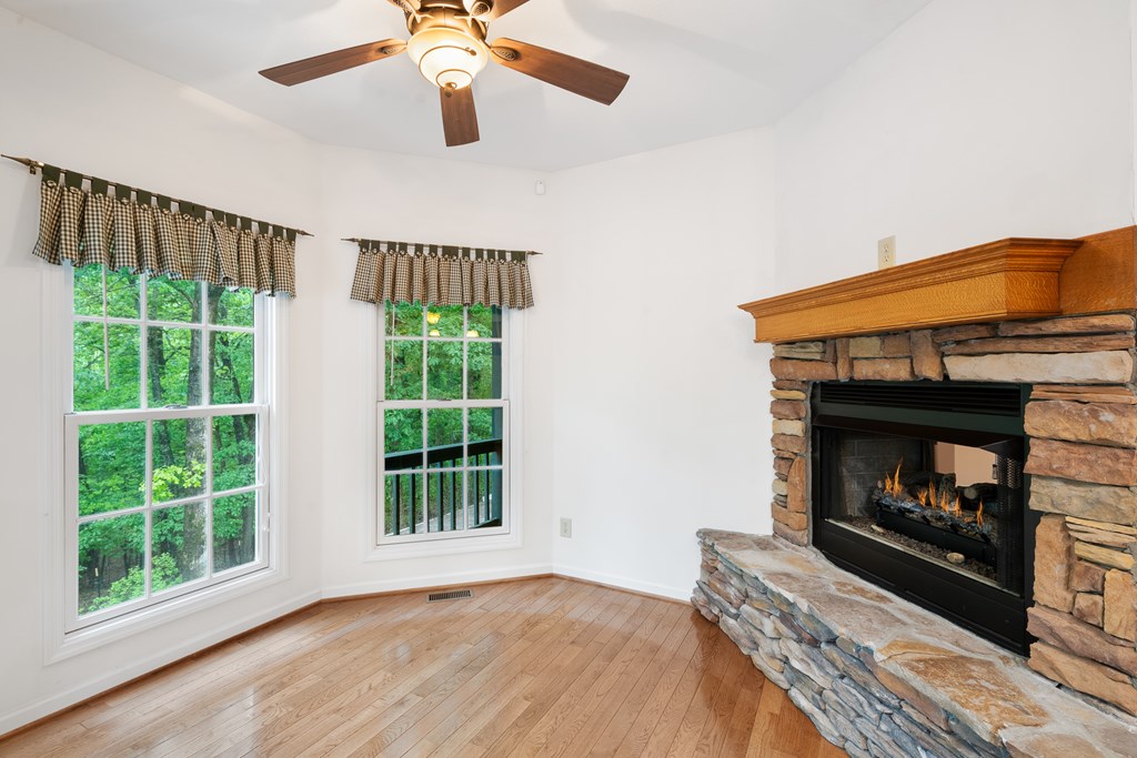 399 Hideaway Hills Road Blairsville, GA 30512 - Photo 47 of 77 a bedroom with fireplace and a window