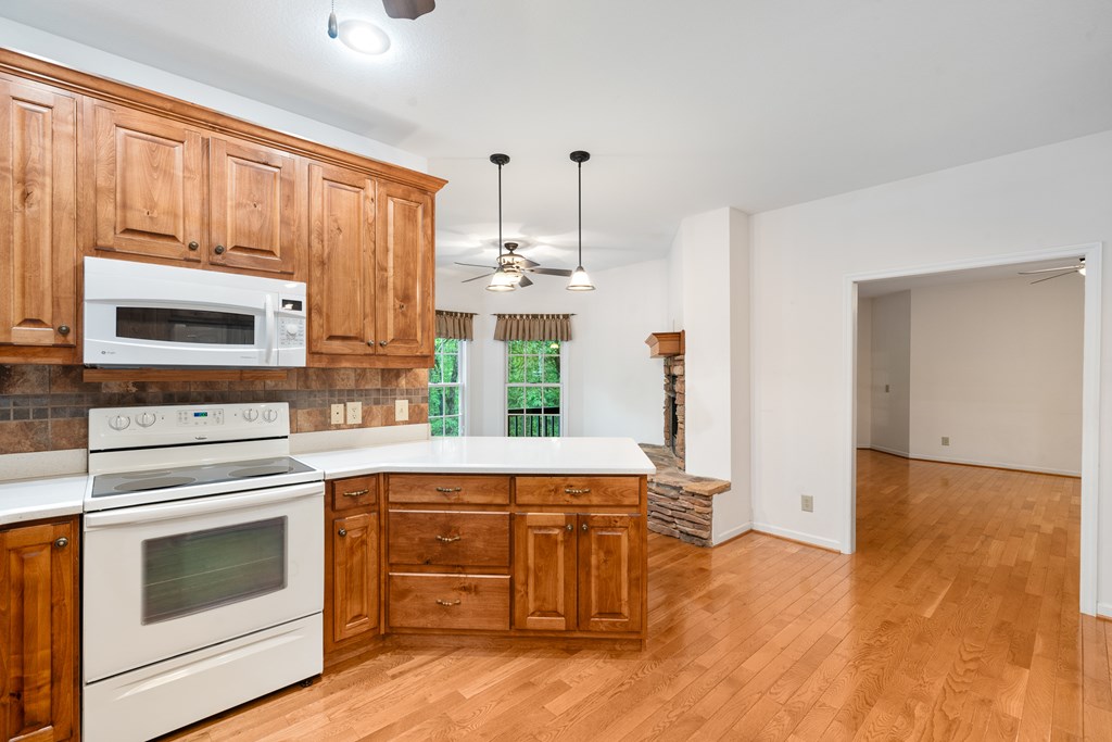 399 Hideaway Hills Road Blairsville, GA 30512 - Photo 51 of 77 a kitchen with stainless steel appliances a stove top oven and a refrigerator