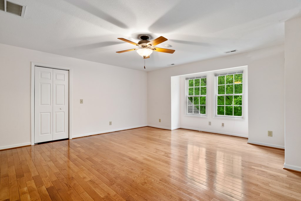 399 Hideaway Hills Road Blairsville, GA 30512 - Photo 56 of 77 a view of an empty room with window and wooden floor