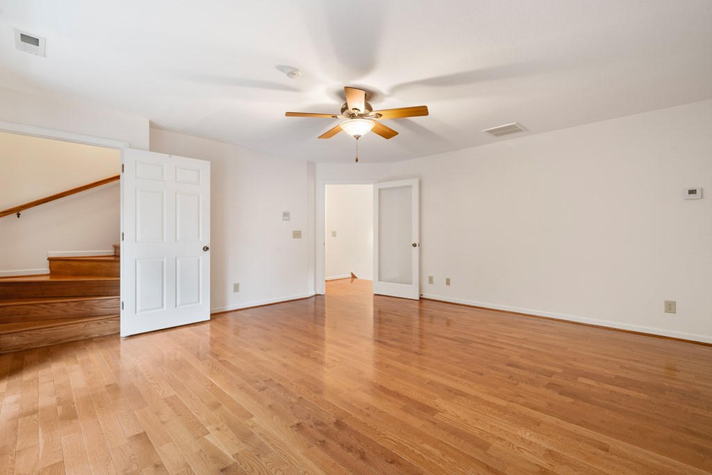 399 Hideaway Hills Road Blairsville, GA 30512 - Photo 57 of 77 wooden floor in an empty room with a window