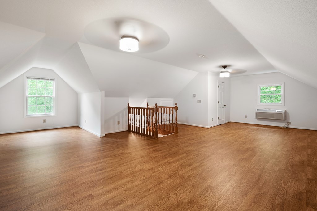 399 Hideaway Hills Road Blairsville, GA 30512 - Photo 59 of 77 a view of an empty room with window and wooden floor