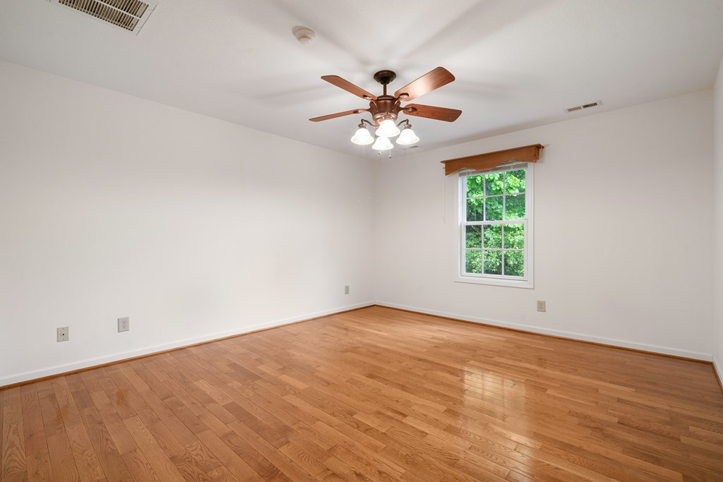 399 Hideaway Hills Road Blairsville, GA 30512 - Photo 60 of 77 an empty room with a window and a fan
