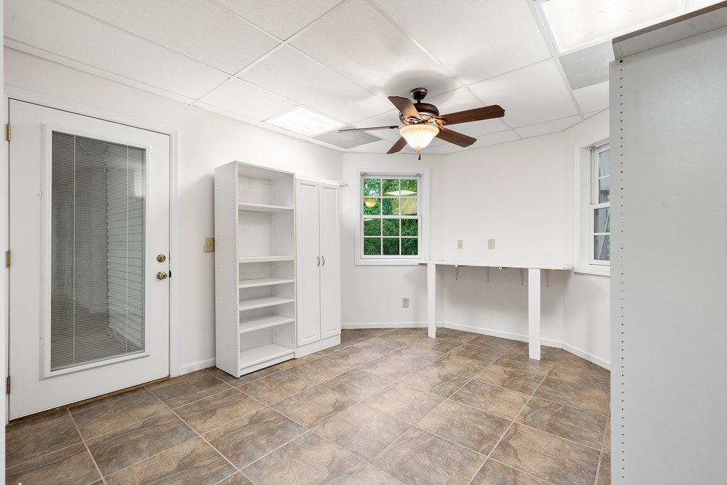 399 Hideaway Hills Road Blairsville, GA 30512 - Photo 69 of 77 an empty room with a ceiling fan and a window