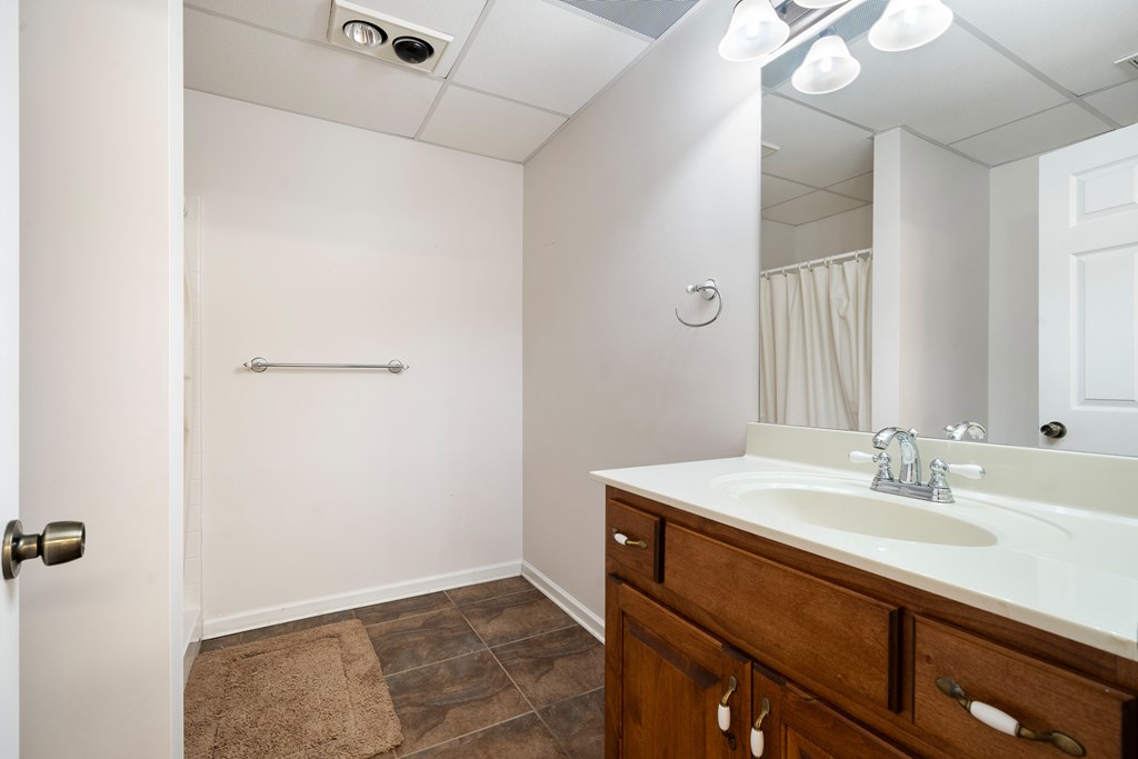 399 Hideaway Hills Road Blairsville, GA 30512 - Photo 75 of 77 a bathroom with a sink mirror and vanity