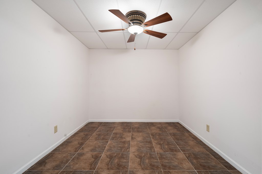 399 Hideaway Hills Road Blairsville, GA 30512 - Photo 77 of 77 a view of a room with a ceiling fan and a window