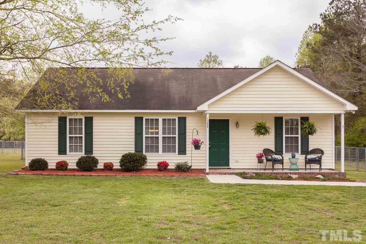 1388 Lee Road Clayton, NC 27520 - Photo 2 of 24 a view of a lounge chair in front of house