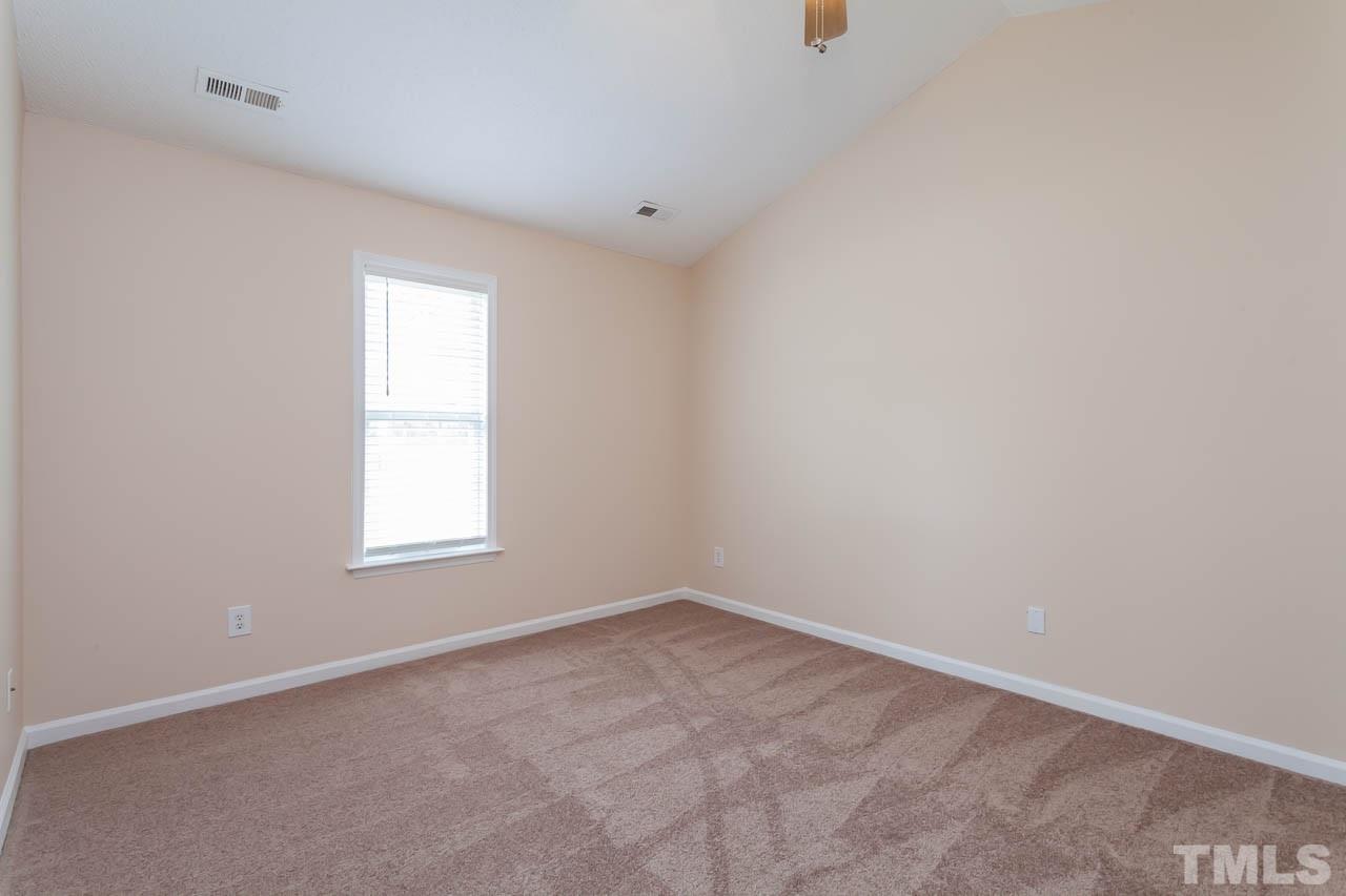 1388 Lee Road Clayton, NC 27520 - Photo 12 of 24 an empty room with windows