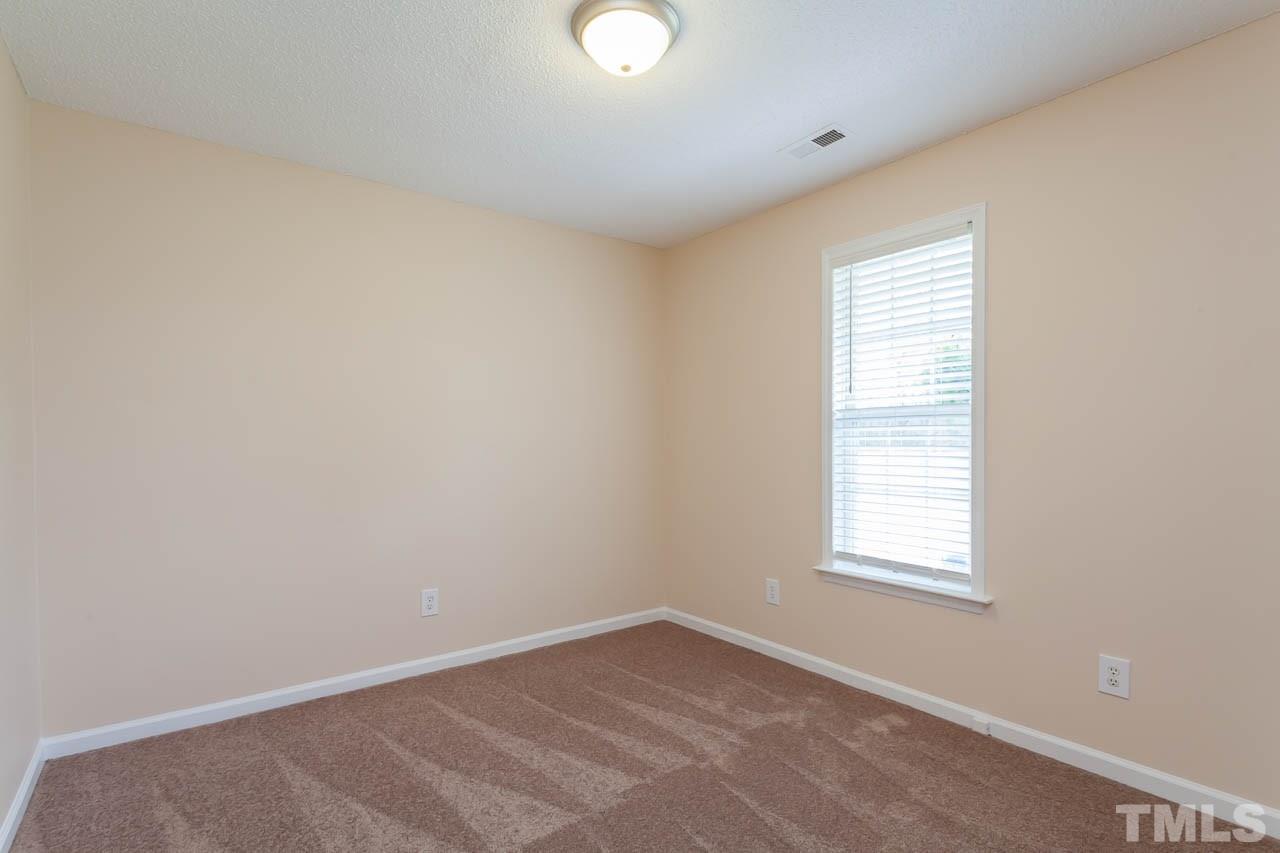 1388 Lee Road Clayton, NC 27520 - Photo 13 of 24 an empty room with a window