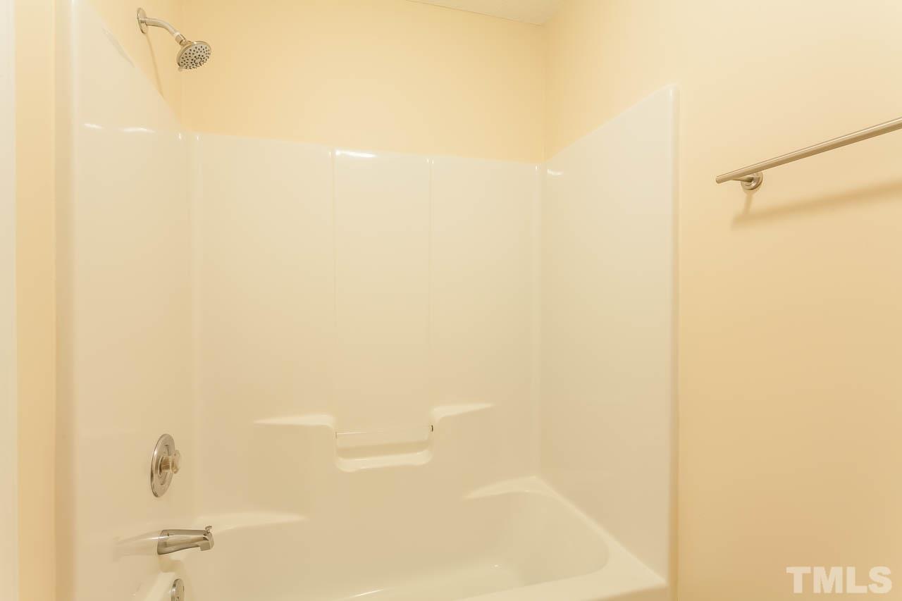 1388 Lee Road Clayton, NC 27520 - Photo 18 of 24 a bathroom with a shower