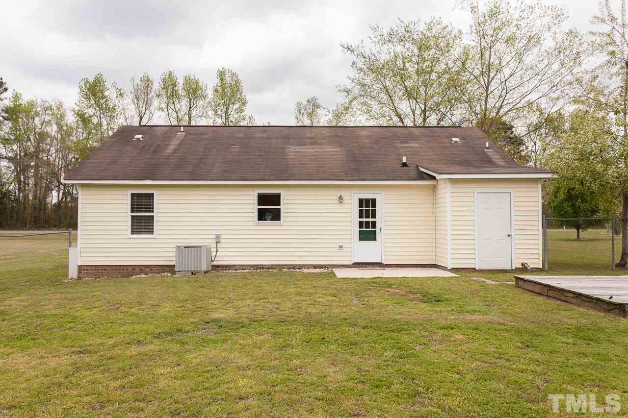 1388 Lee Road Clayton, NC 27520 - Photo 20 of 24 a view of a house with a backyard