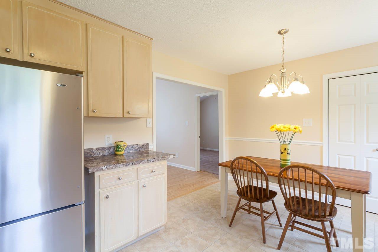 1388 Lee Road Clayton, NC 27520 - Photo 7 of 24 a dining room with furniture and window