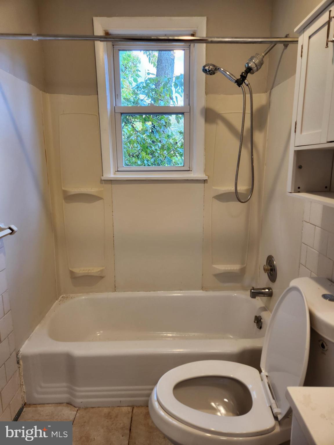3817 Birchview Avenue, Unit 1 Baltimore, MD 21206 - Photo 9 of 19 a bathroom with a sink a toilet and a bathtub