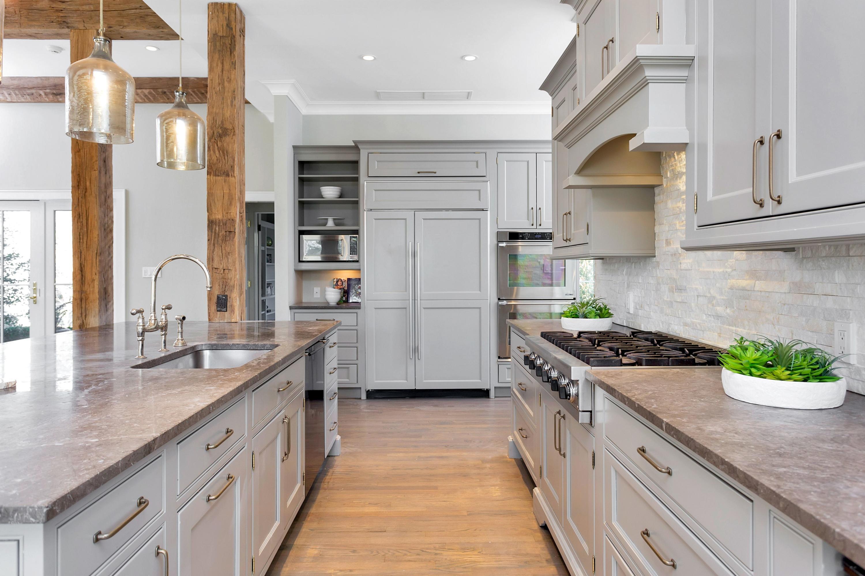 9 Searles Road Darien, CT 06820 - Photo 12 of 40 a kitchen with stainless steel appliances granite countertop a stove a sink and a refrigerator