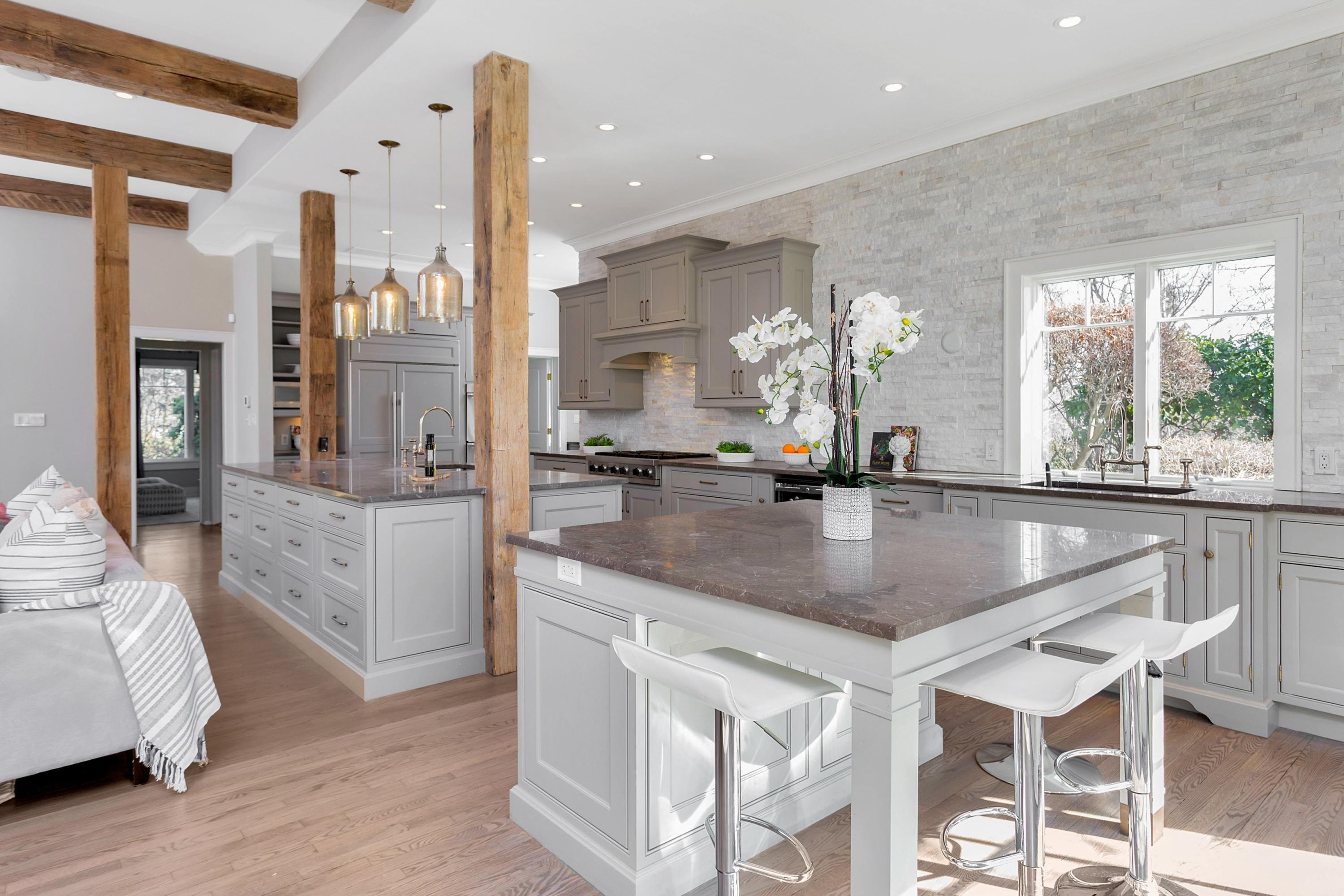 9 Searles Road Darien, CT 06820 - Photo 16 of 40 a kitchen with stainless steel appliances granite countertop a sink a stove and a wooden floors