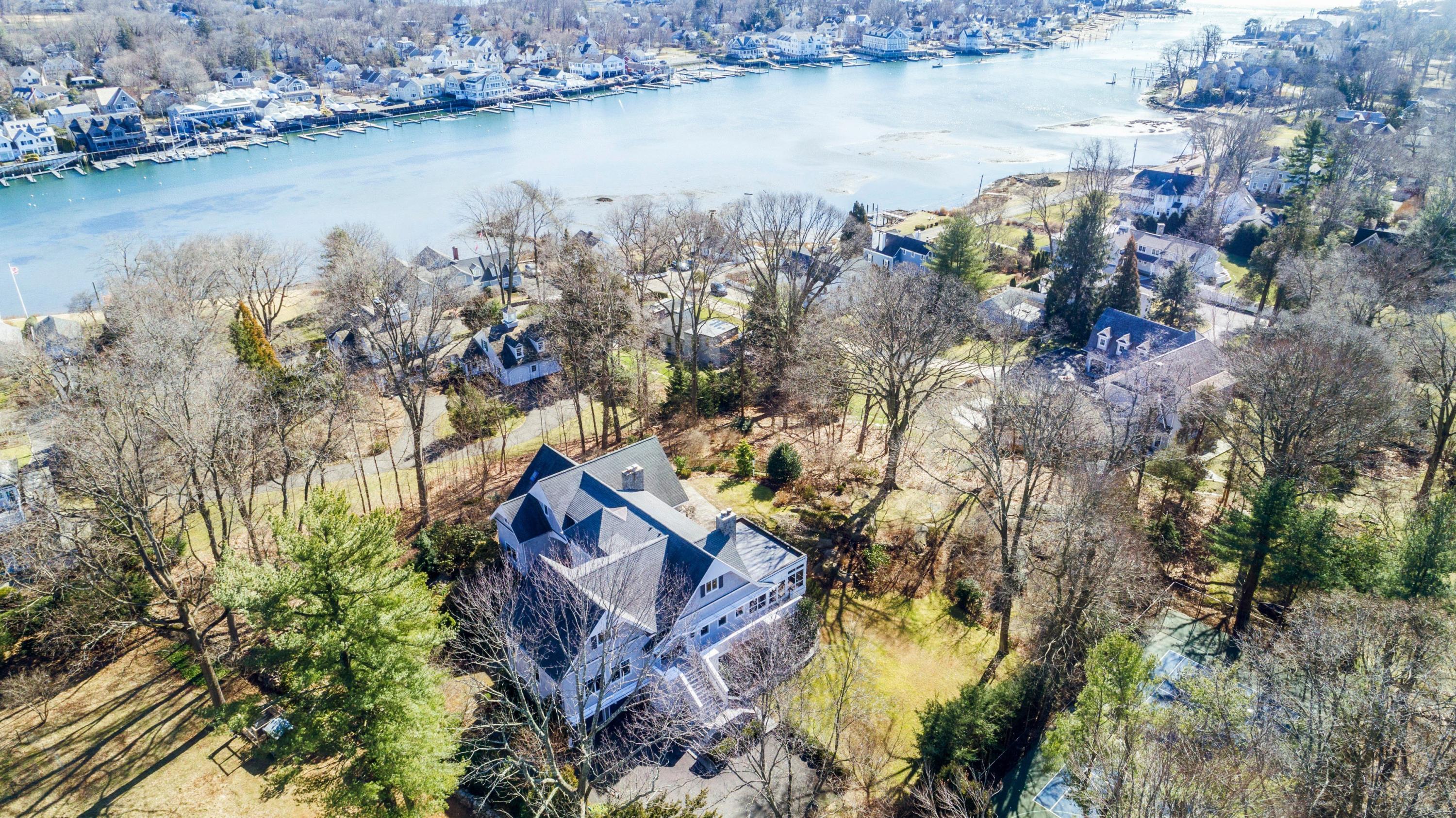 9 Searles Road Darien, CT 06820 - Photo 2 of 40 an aerial view of residential houses with outdoor space and lake view