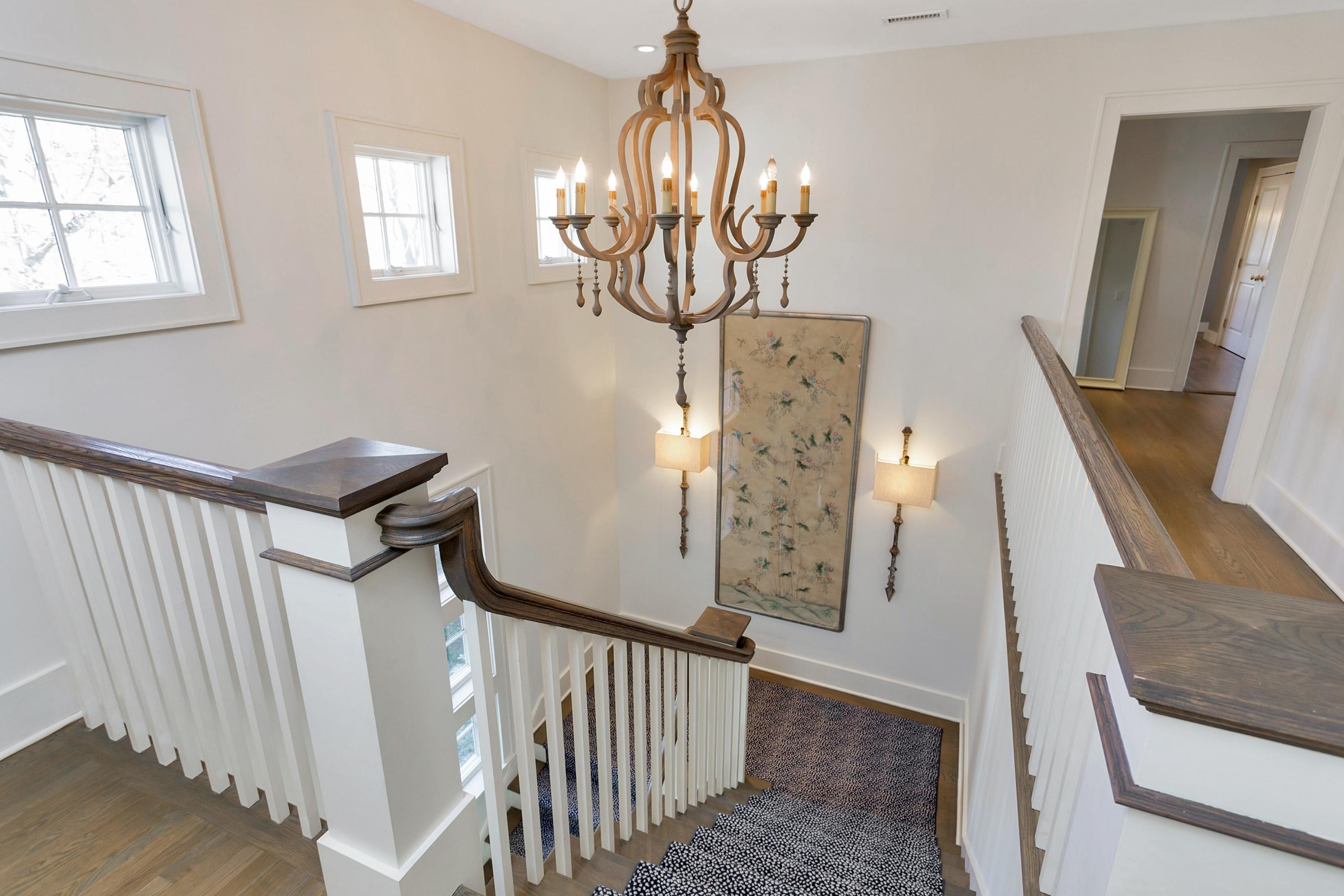 9 Searles Road Darien, CT 06820 - Photo 21 of 40 a view of a livingroom with furniture window wooden floor and stairs