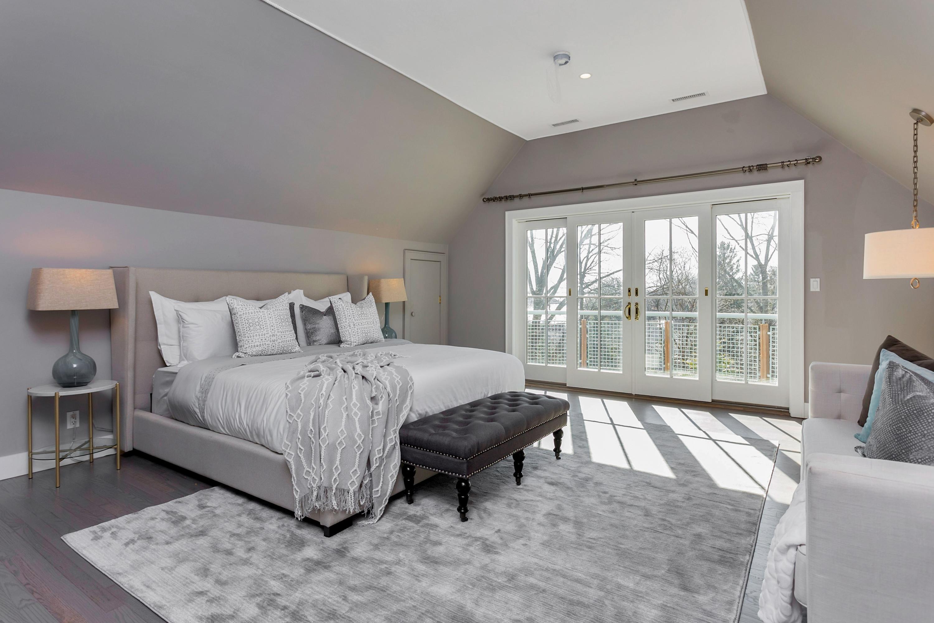 9 Searles Road Darien, CT 06820 - Photo 24 of 40 a spacious bedroom with a bed and a large window