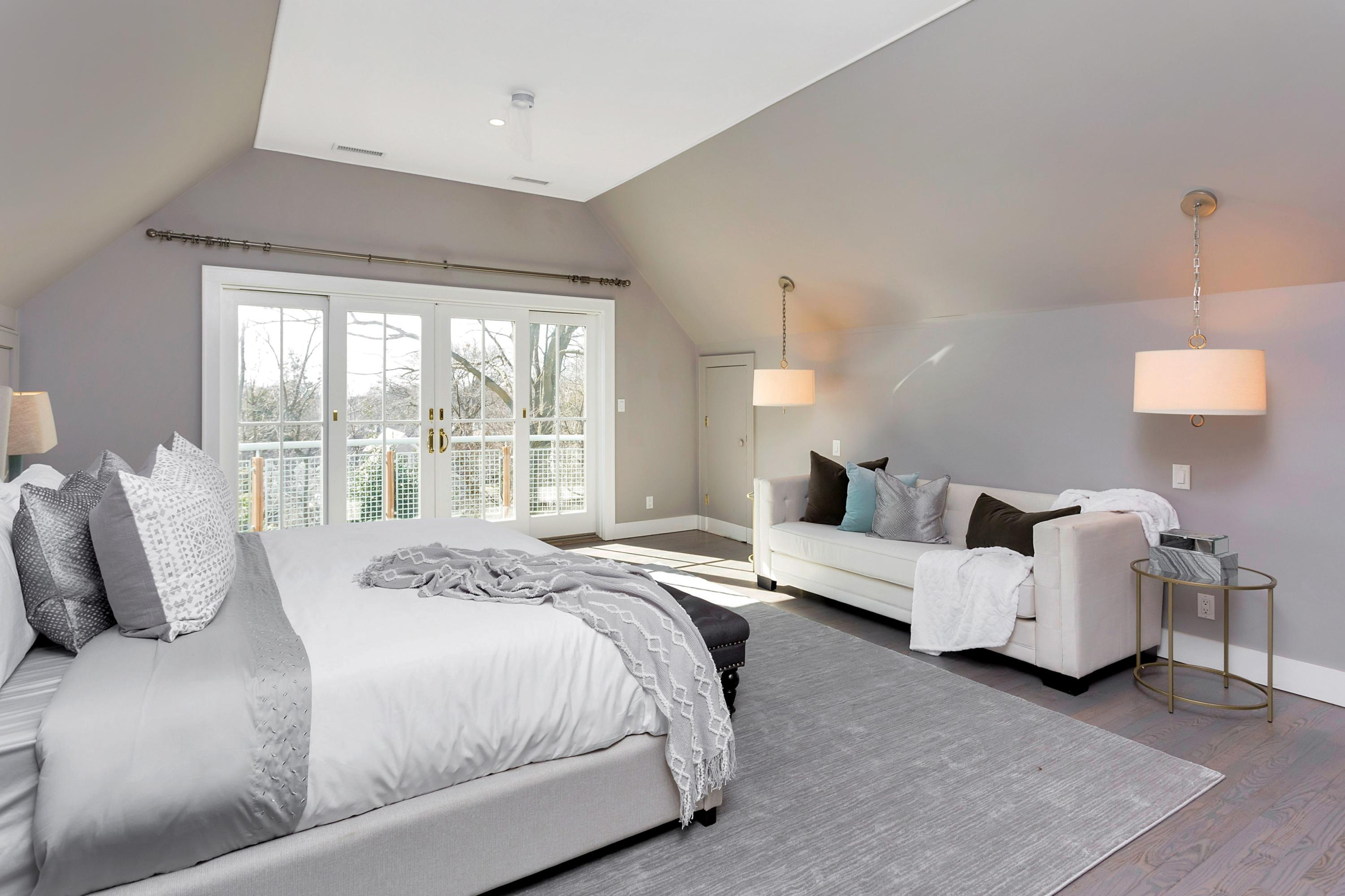 9 Searles Road Darien, CT 06820 - Photo 25 of 40 a bedroom with a bed and a large window