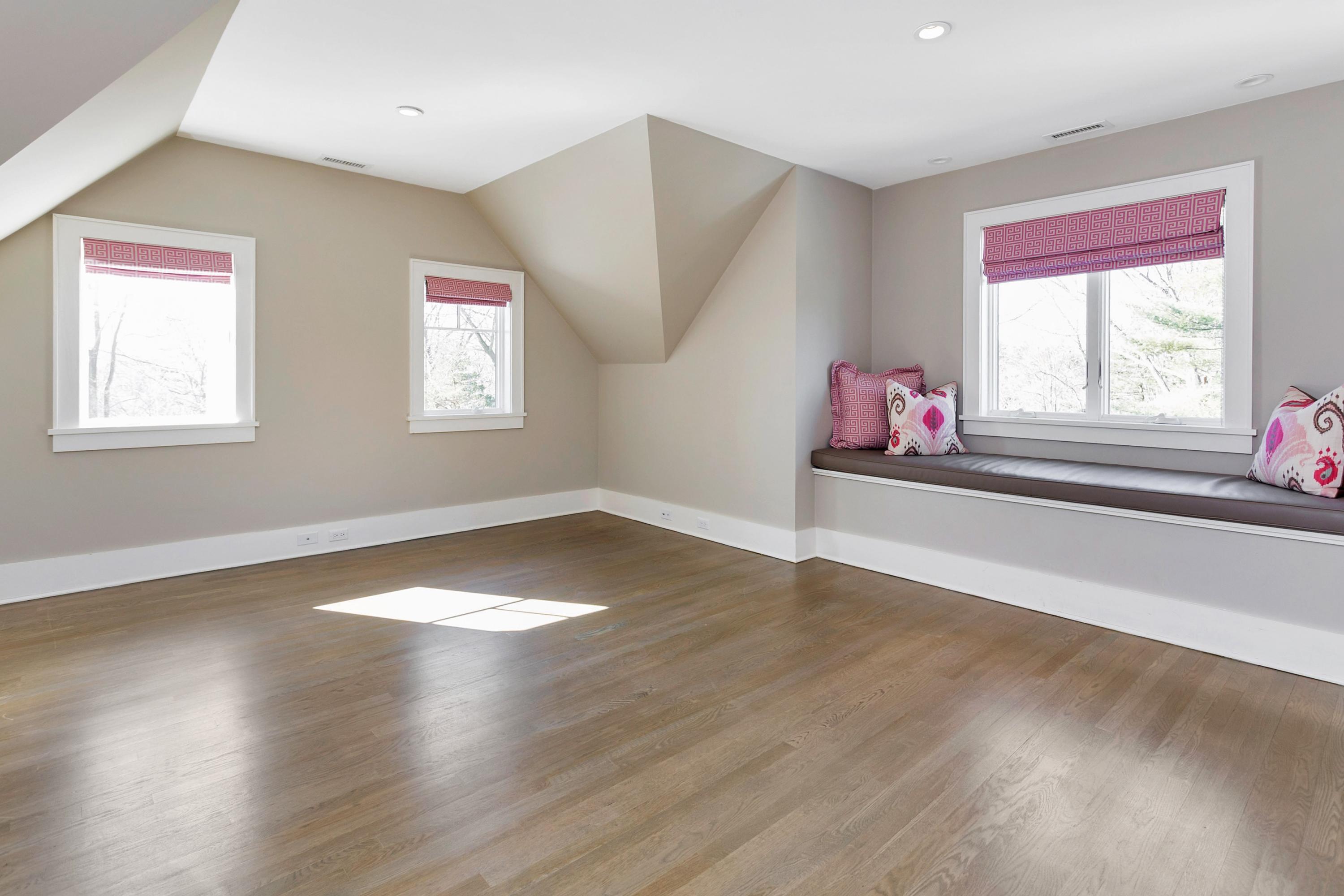 9 Searles Road Darien, CT 06820 - Photo 27 of 40 a view of empty room with wooden floor and fan