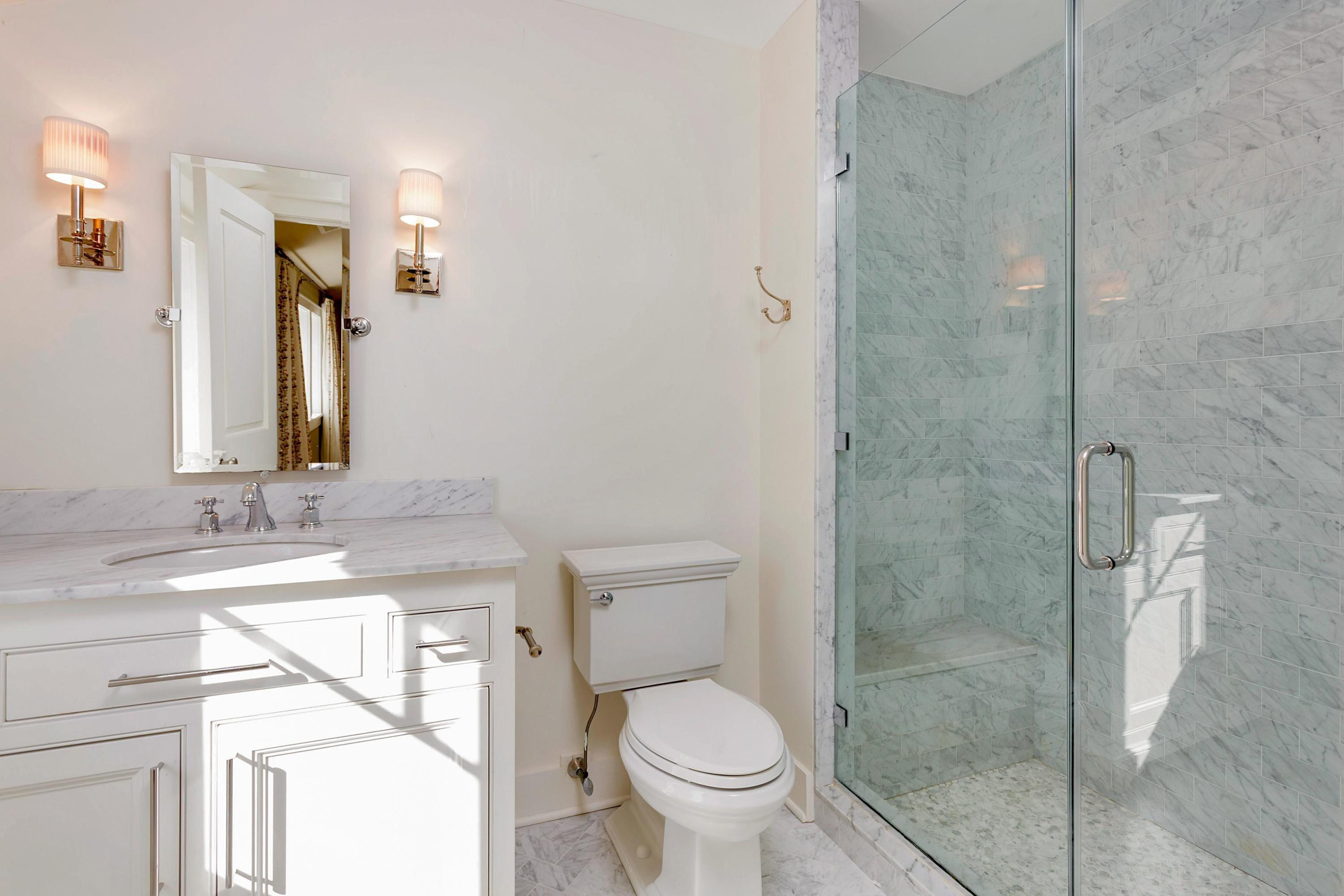 9 Searles Road Darien, CT 06820 - Photo 28 of 40 a bathroom with a granite countertop sink toilet and shower