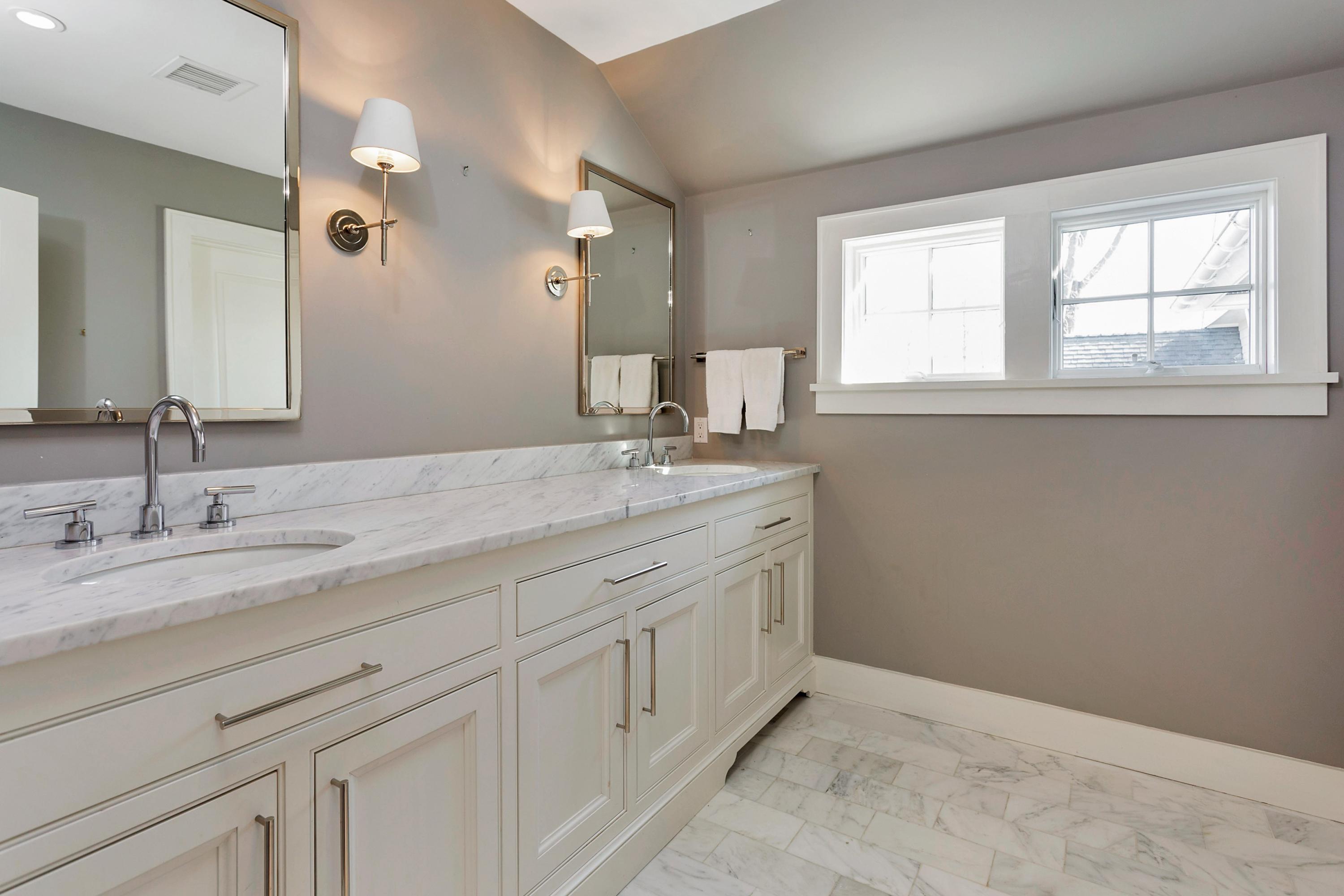 9 Searles Road Darien, CT 06820 - Photo 30 of 40 a bathroom with a sink and a mirror