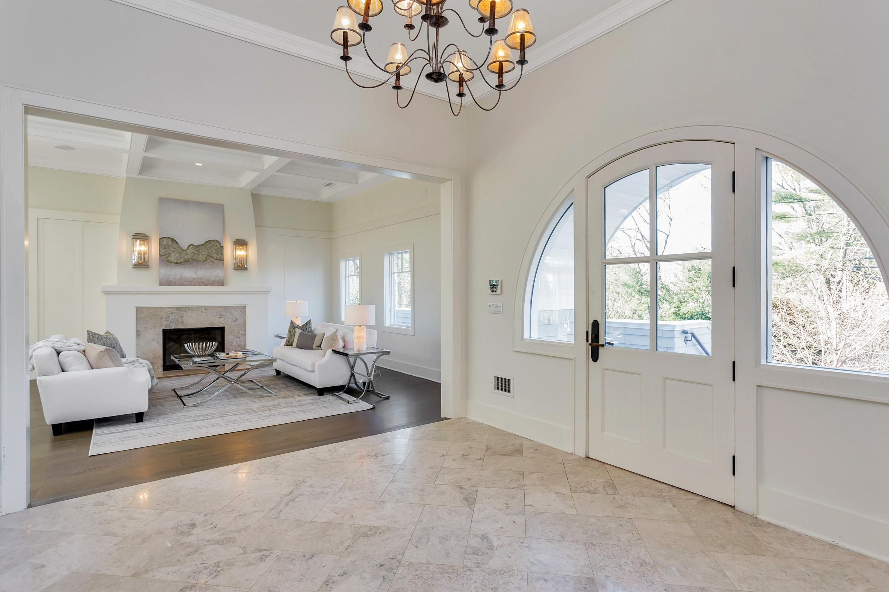 9 Searles Road Darien, CT 06820 - Photo 3 of 40 a living room with furniture and a fireplace