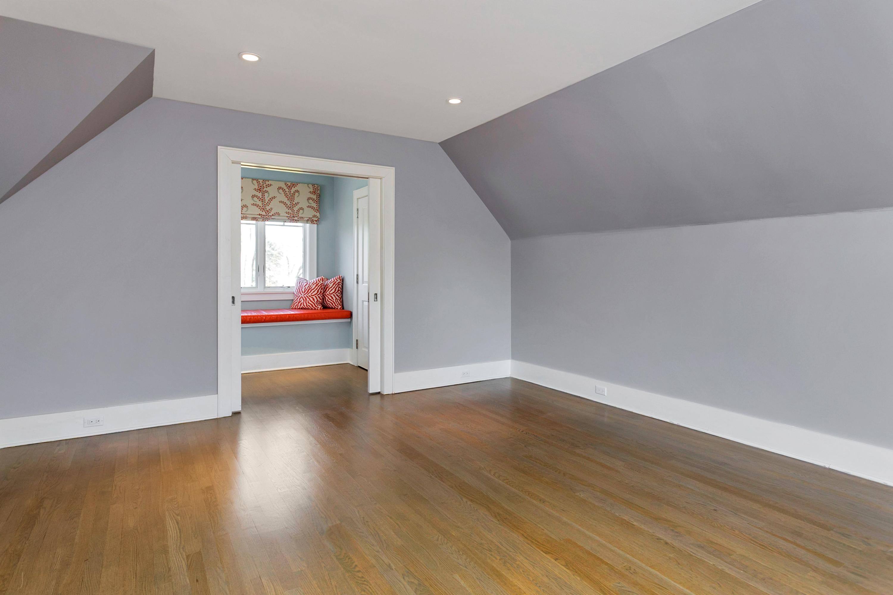 9 Searles Road Darien, CT 06820 - Photo 33 of 40 a view of an empty room with wooden floor and a window