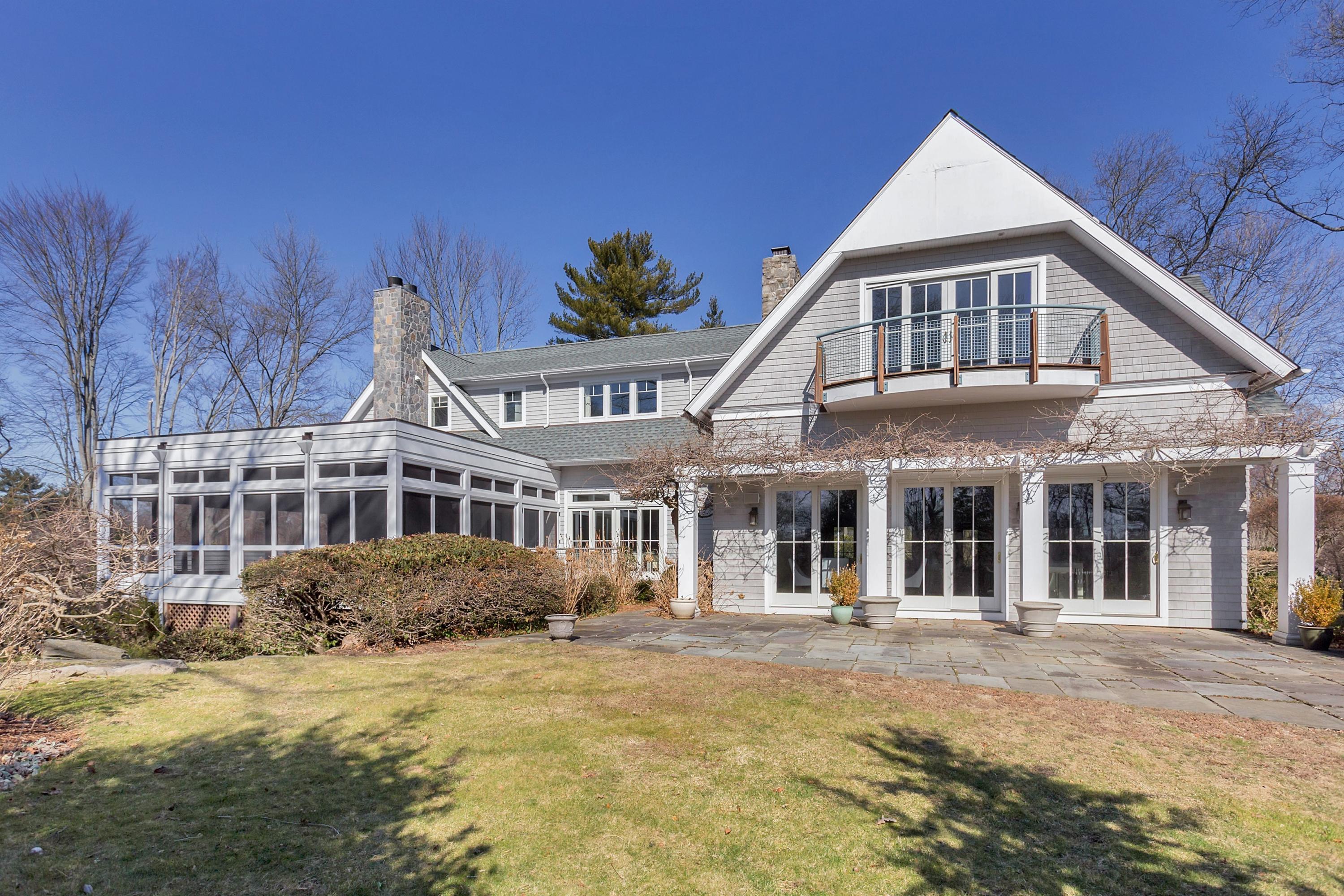 9 Searles Road Darien, CT 06820 - Photo 34 of 40 a front view of a house with a yard