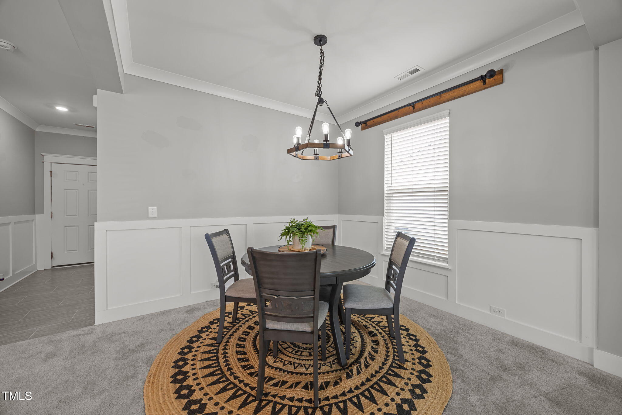 456 Highview Drive Benson, NC 27504 - Photo 11 of 36 a dining room with furniture a chandelier and wooden floor