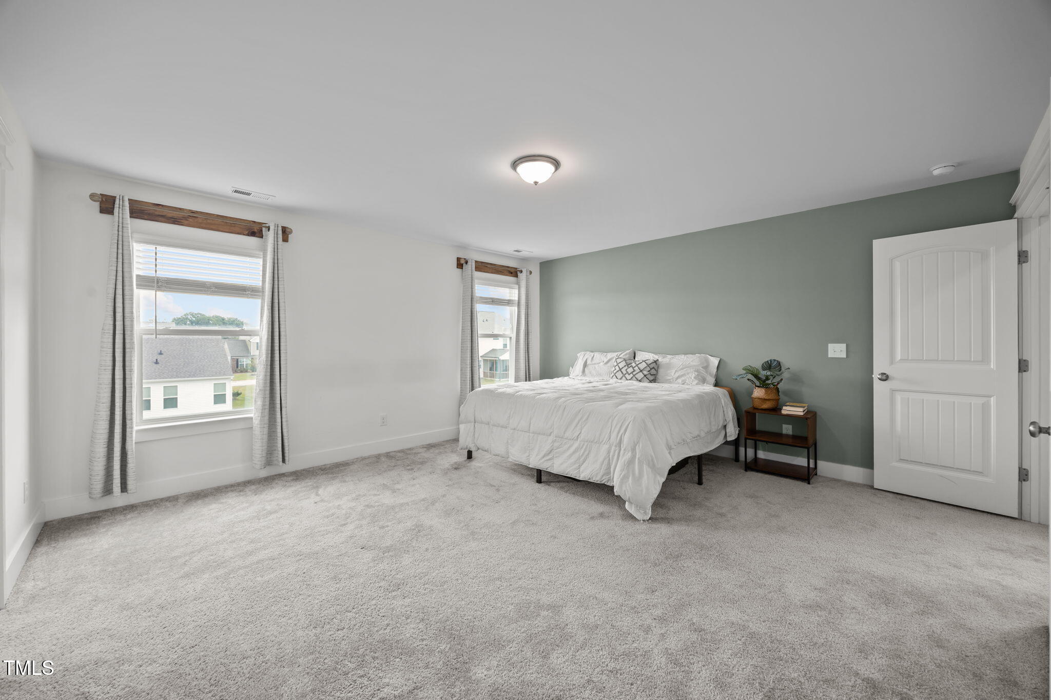 456 Highview Drive Benson, NC 27504 - Photo 15 of 36 a spacious bedroom with a bed and a cabinets