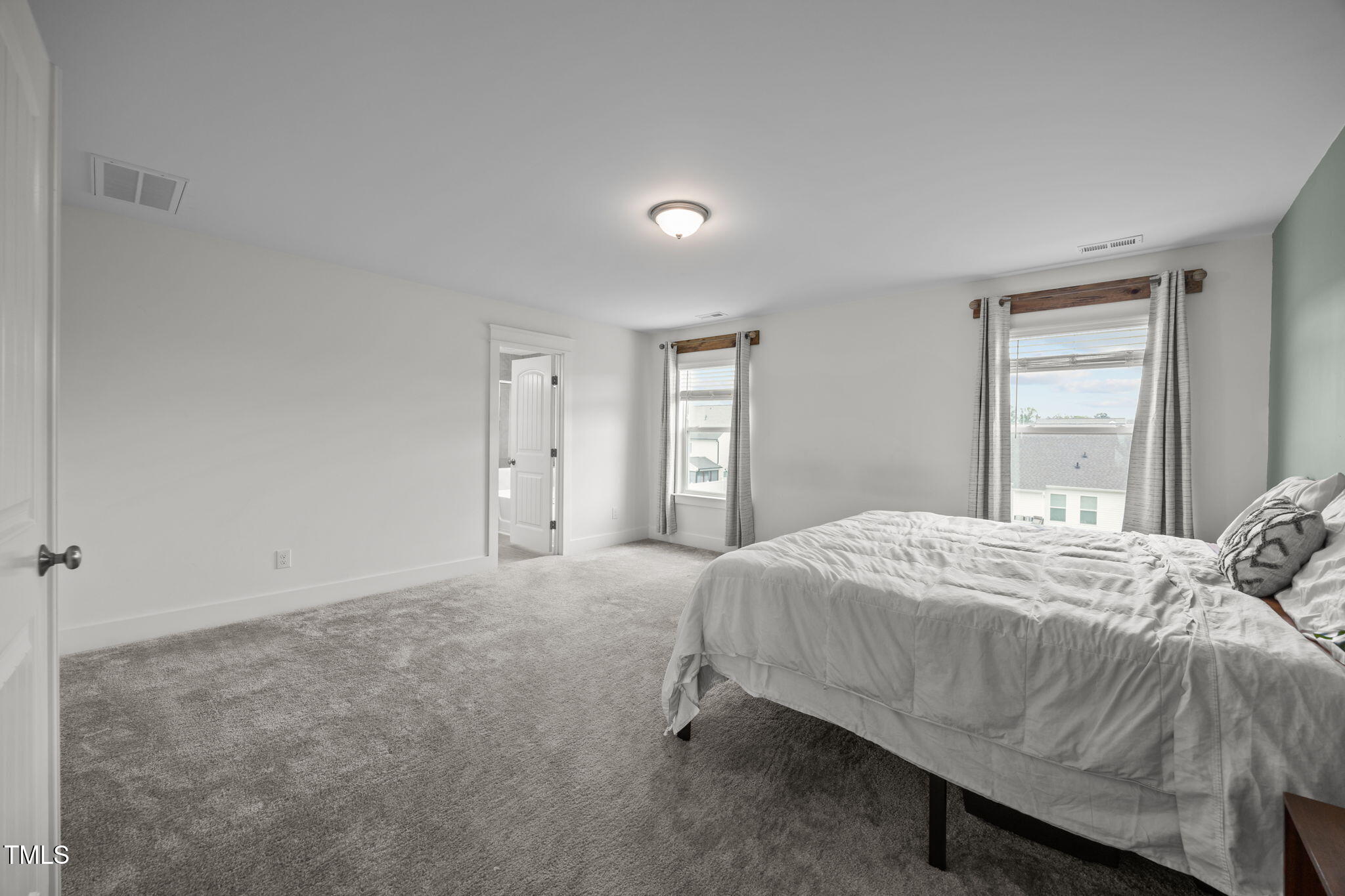 456 Highview Drive Benson, NC 27504 - Photo 16 of 36 a bedroom with a bed and a window