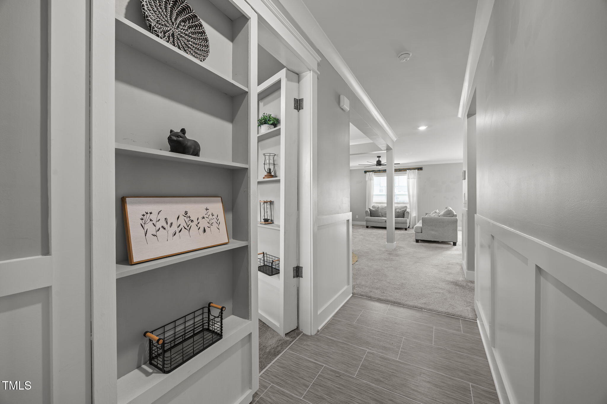 456 Highview Drive Benson, NC 27504 - Photo 20 of 36 a view of a hallway to a room with a bench