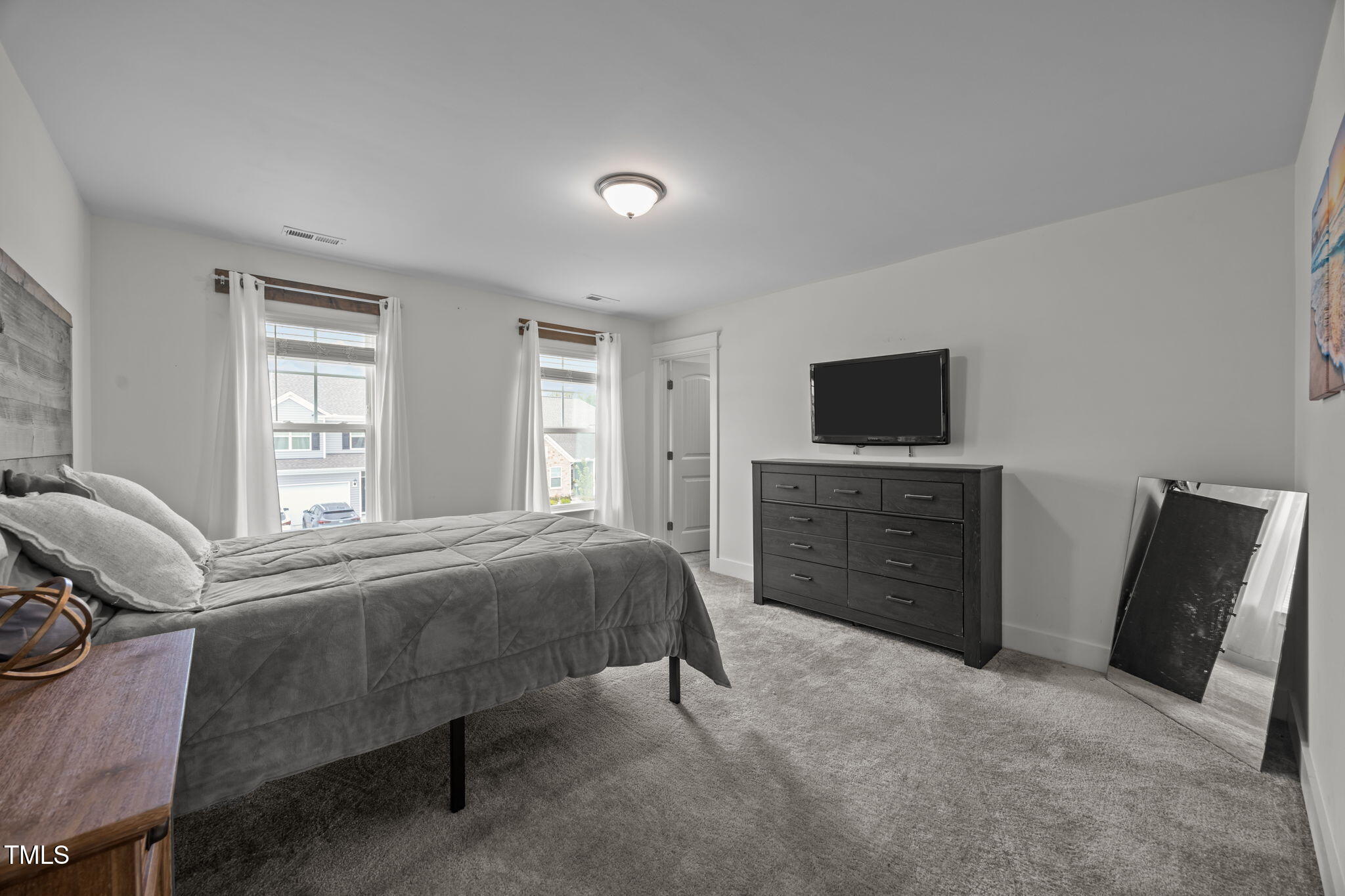 456 Highview Drive Benson, NC 27504 - Photo 21 of 36 a bedroom with a bed and a television