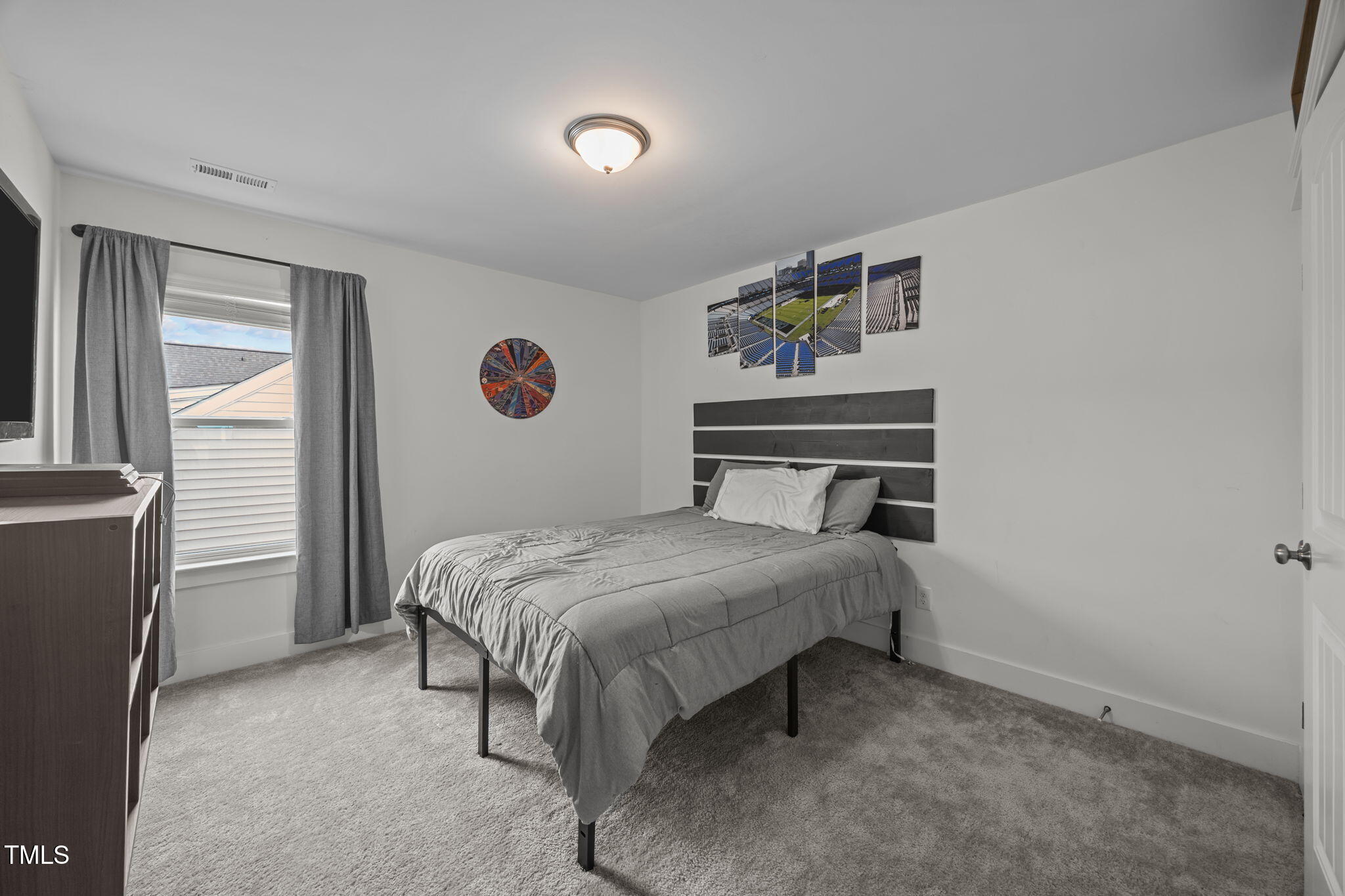 456 Highview Drive Benson, NC 27504 - Photo 23 of 36 a bedroom with a bed and window