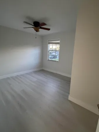 a view of a tree in front of a yard