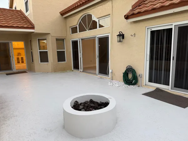 a bathroom with a granite countertop sink a large mirror and a bathtub