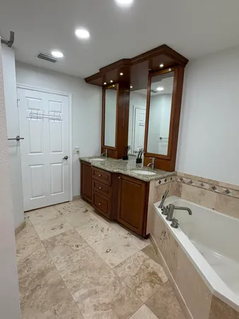 an empty room with closet and bathroom