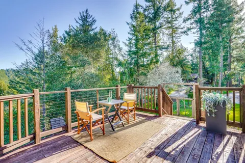 a view of balcony with furniture and wooden deck