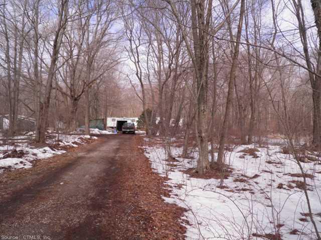 156 Terwilleger Road Killingly, CT 06239 - Photo 1 of 1 a view of a yard with snow on the road