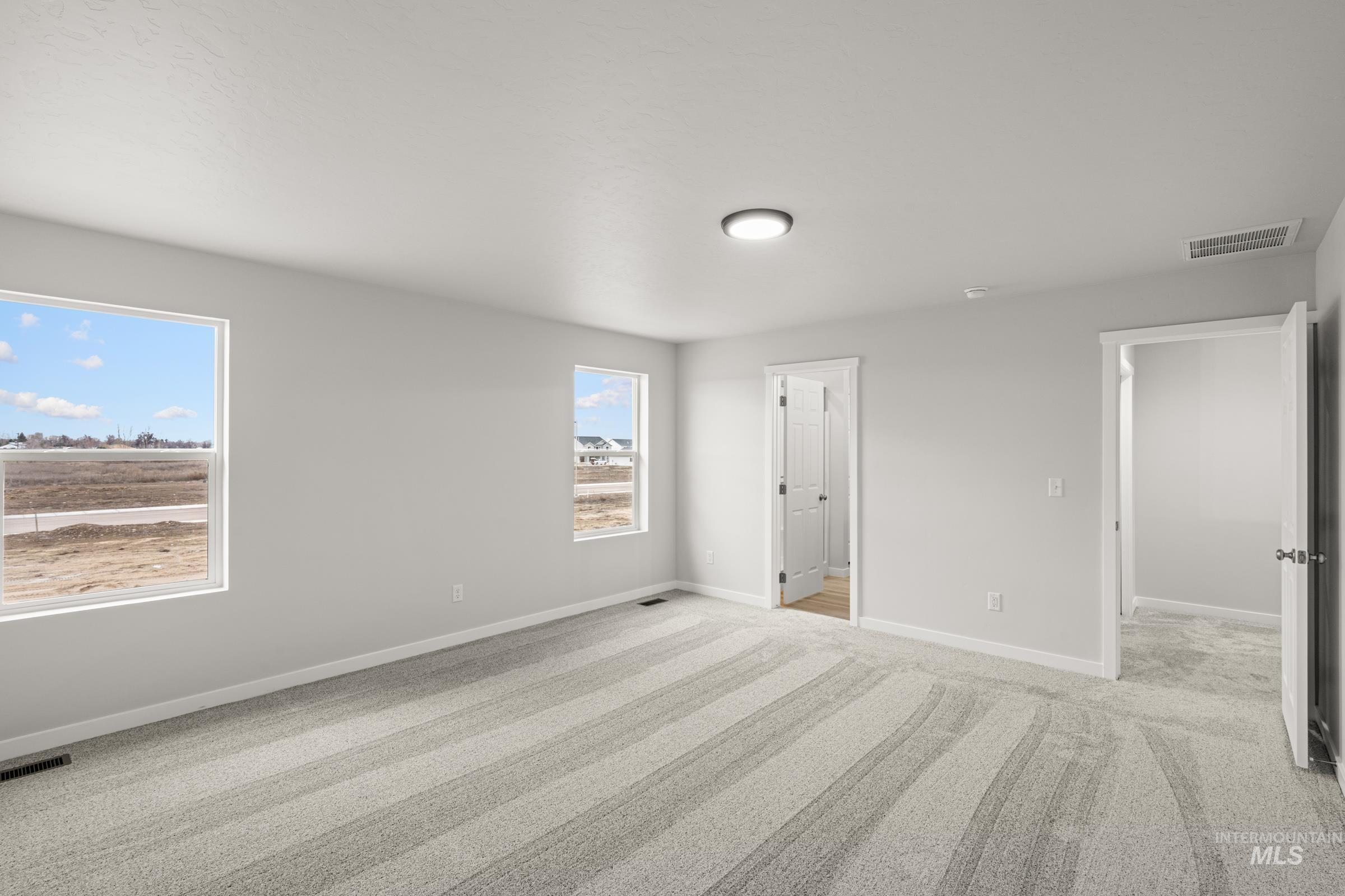 13693 Redway Court Caldwell, ID 83607 - Photo 20 of 25 Unfurnished bedroom with light carpet and baseboards
