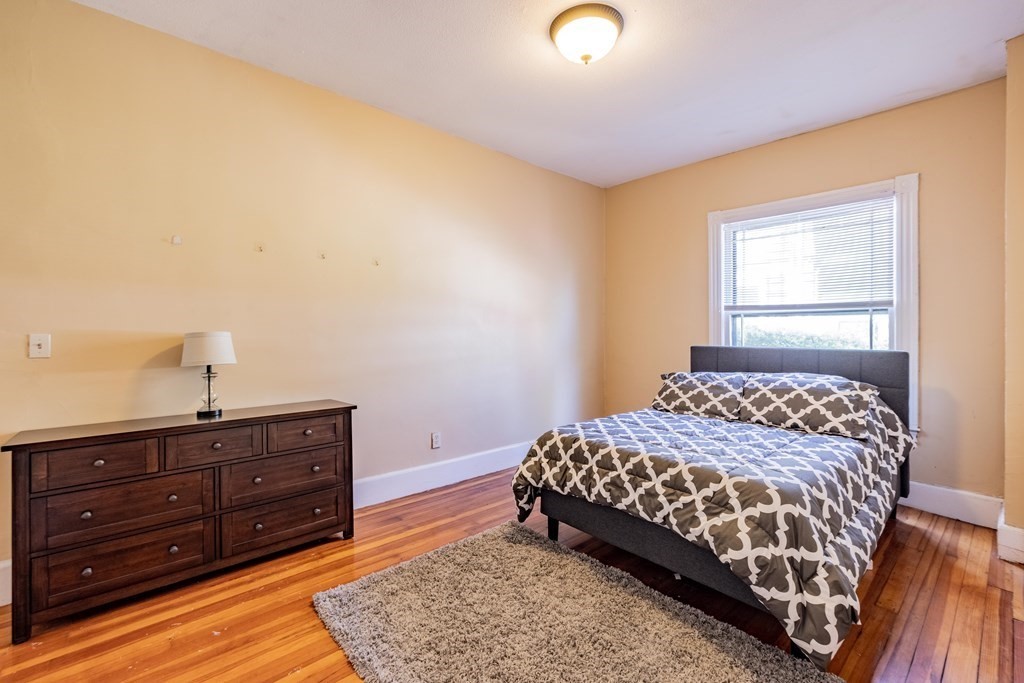 47 Magnolia Terrace Springfield, MA 01108 - Photo 18 of 37 a bedroom with a bed and a dresser