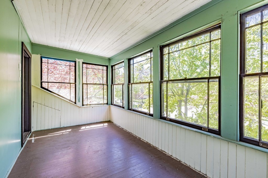 47 Magnolia Terrace Springfield, MA 01108 - Photo 29 of 37 a view of an empty room with a window and wooden floor