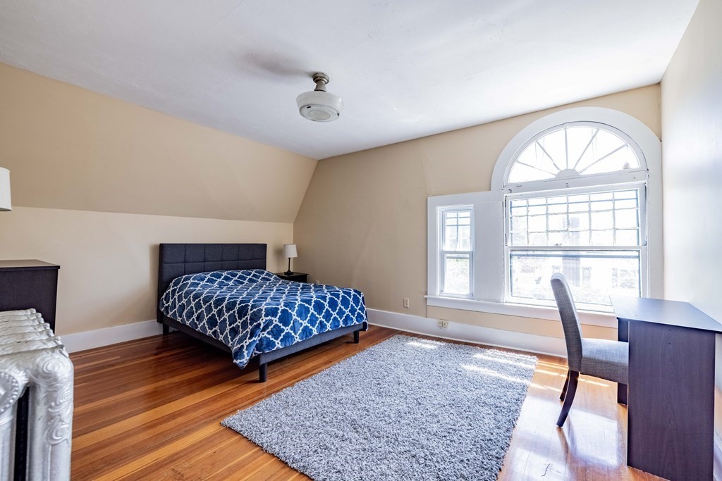 47 Magnolia Terrace Springfield, MA 01108 - Photo 35 of 37 a bedroom with two beds and a large window