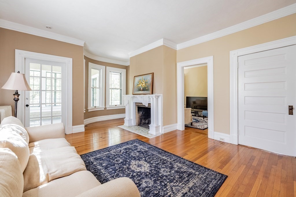 47 Magnolia Terrace Springfield, MA 01108 - Photo 10 of 37 a living room with furniture and a fireplace
