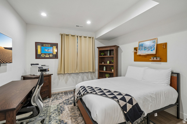 1107 West Wasatch Springs Road, Unit M3 Heber City, UT 84036 - Photo 11 of 34 Recessed ceiling lighting, window with drapes, wood-finish flooring, and white walls