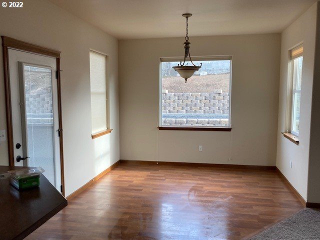 1734 Southwest 3rd Street Pendleton, OR 97801 - Photo 4 of 29 a view of an empty room with wooden floor and a window