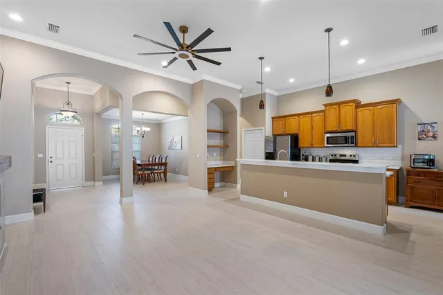 a view of a kitchen with a sink and a stove top oven